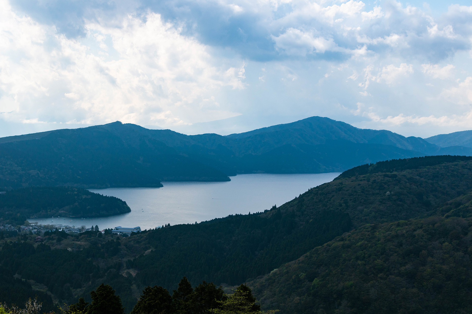 Distant lake surrounded by mountains.